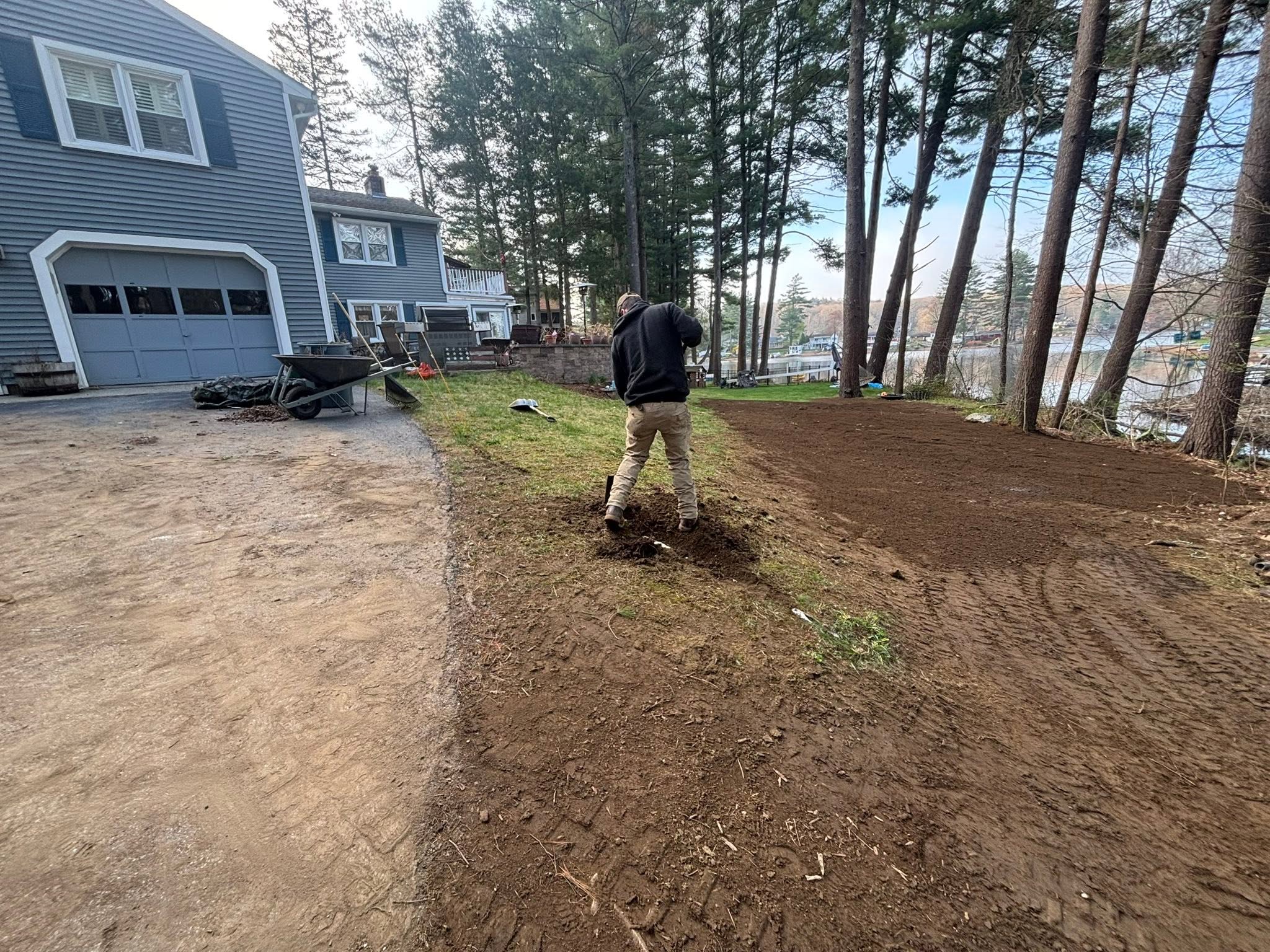 Backyard drainage problem — water trapping behind concrete